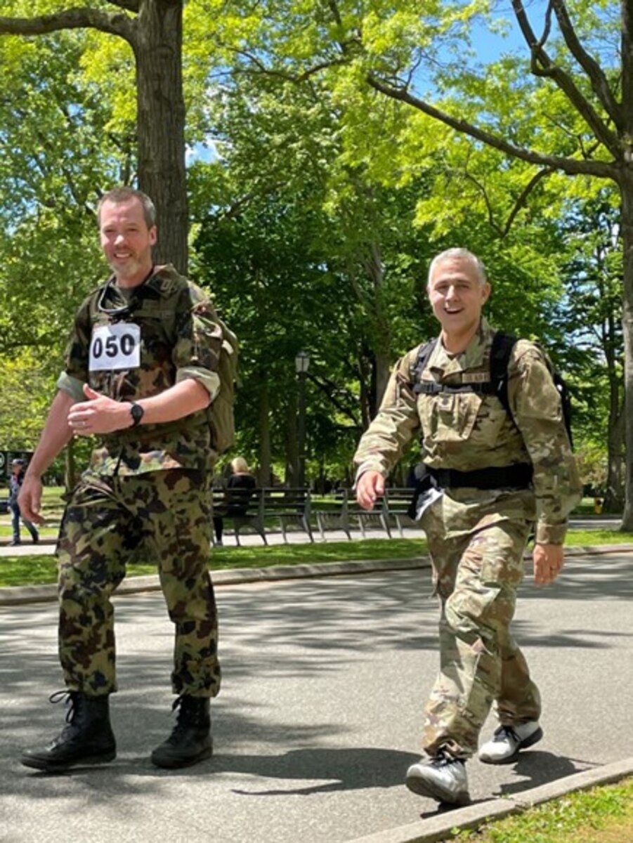Photo of two people walking.