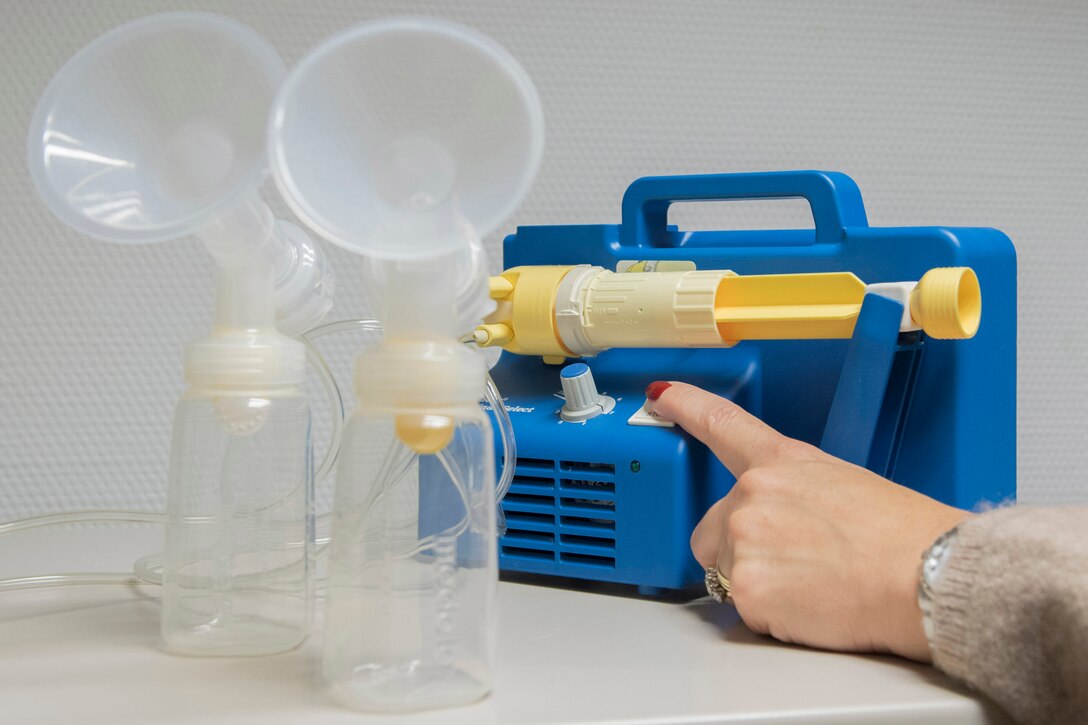 Kristin Scherzer, the Women, Infants and Children Overseas regional manager, points out the features of one of the hospital-grade breast pumps available at the WIC Overseas office at Ramstein Air Base, Germany, Oct. 5, 2020. Women in the program who are breastfeeding can take advantage of a breast pump loan service, available to them for the duration of breastfeeding. (U.S. Air Force photo by Airman 1st Class John R. Wright)