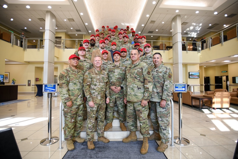 Military members take a group photo.
