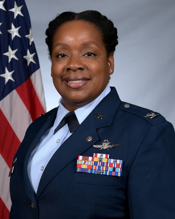 A picture of a female officer in dress blues