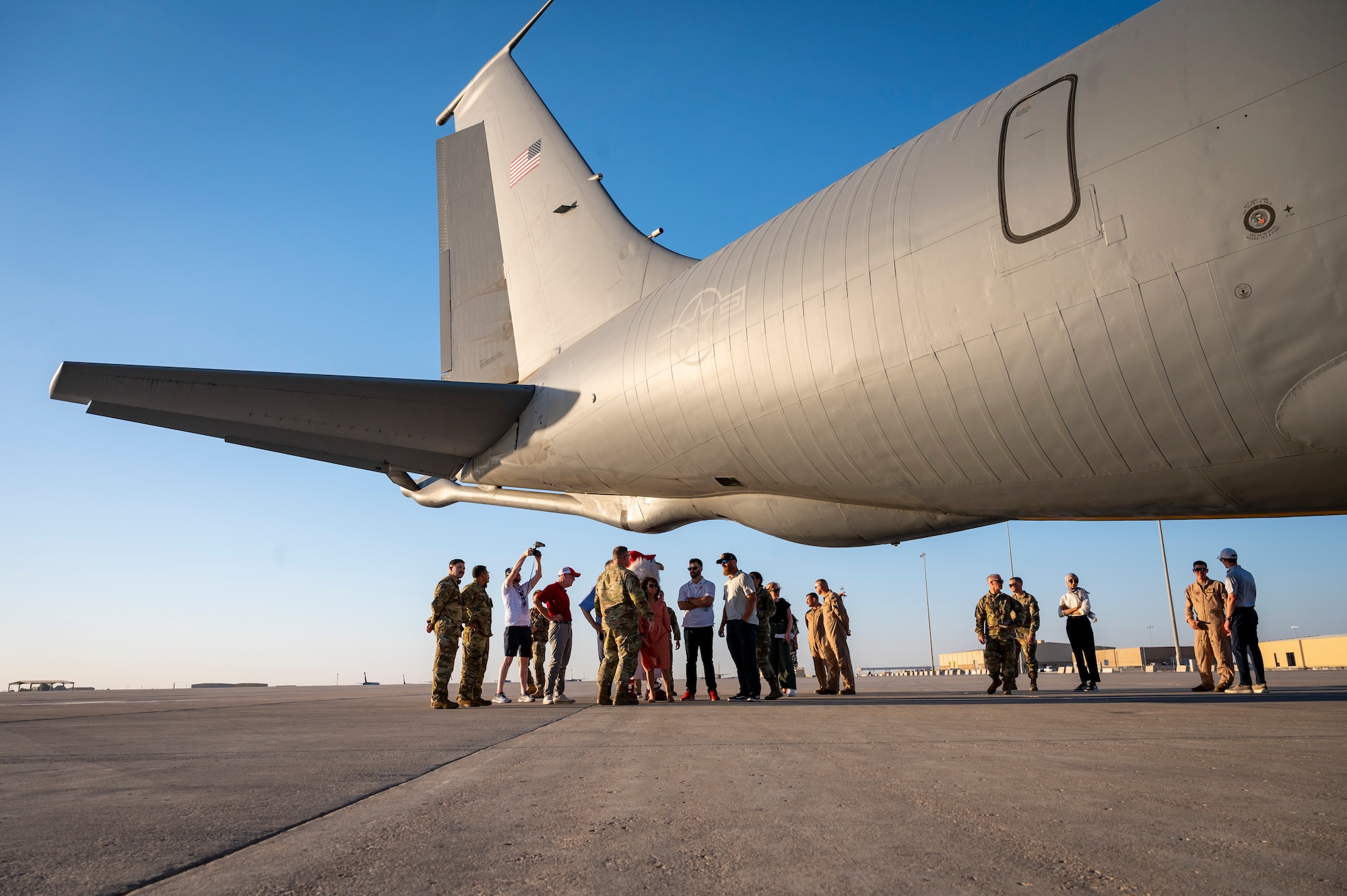 People standing around an aircraft