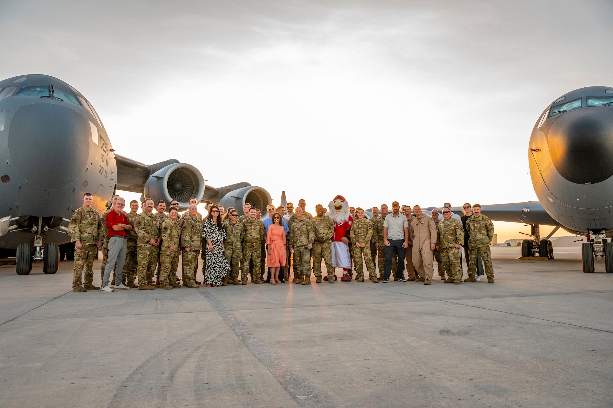 A group of people on a flight line