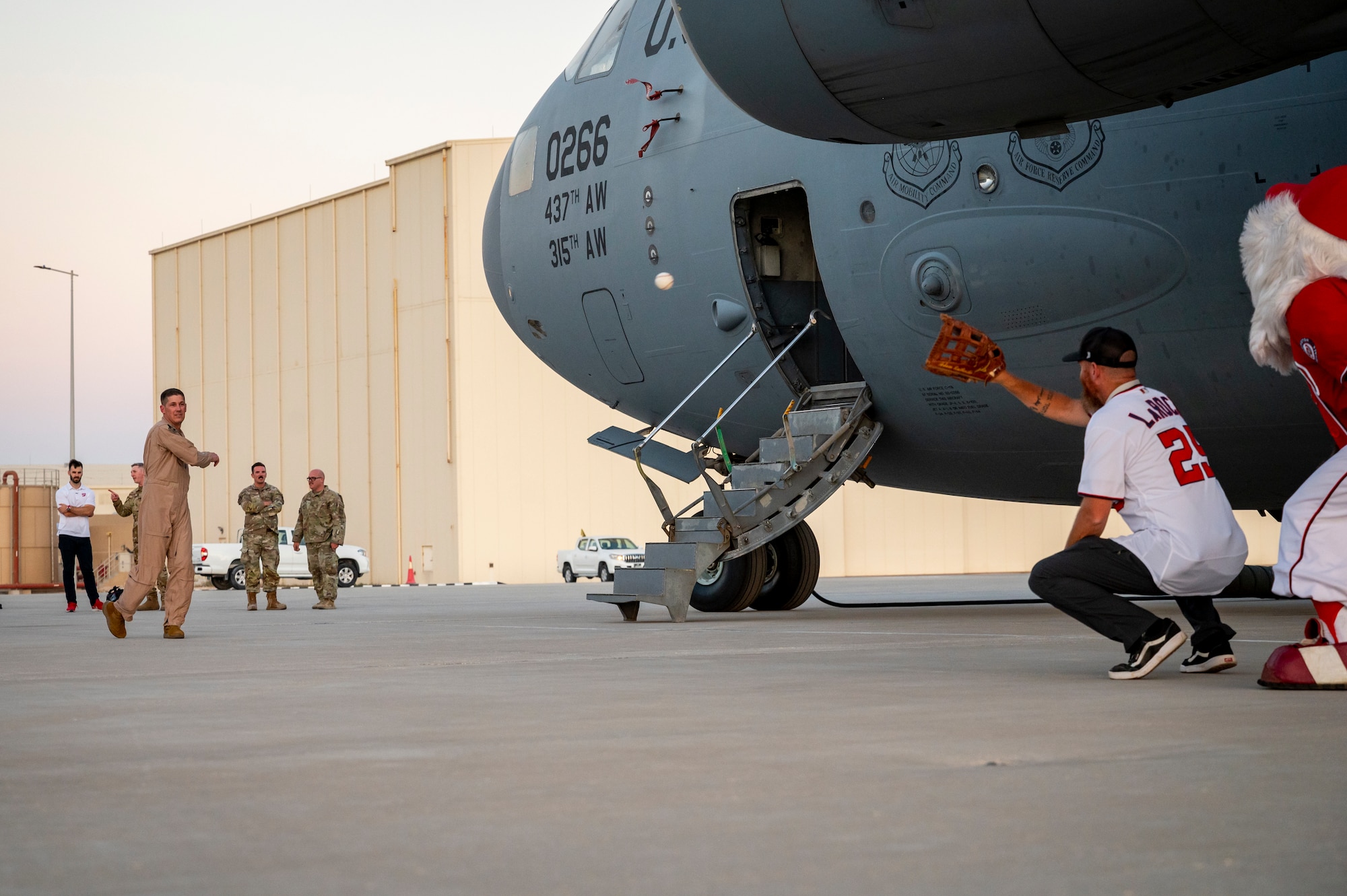Person throwing a baseball on a flight line