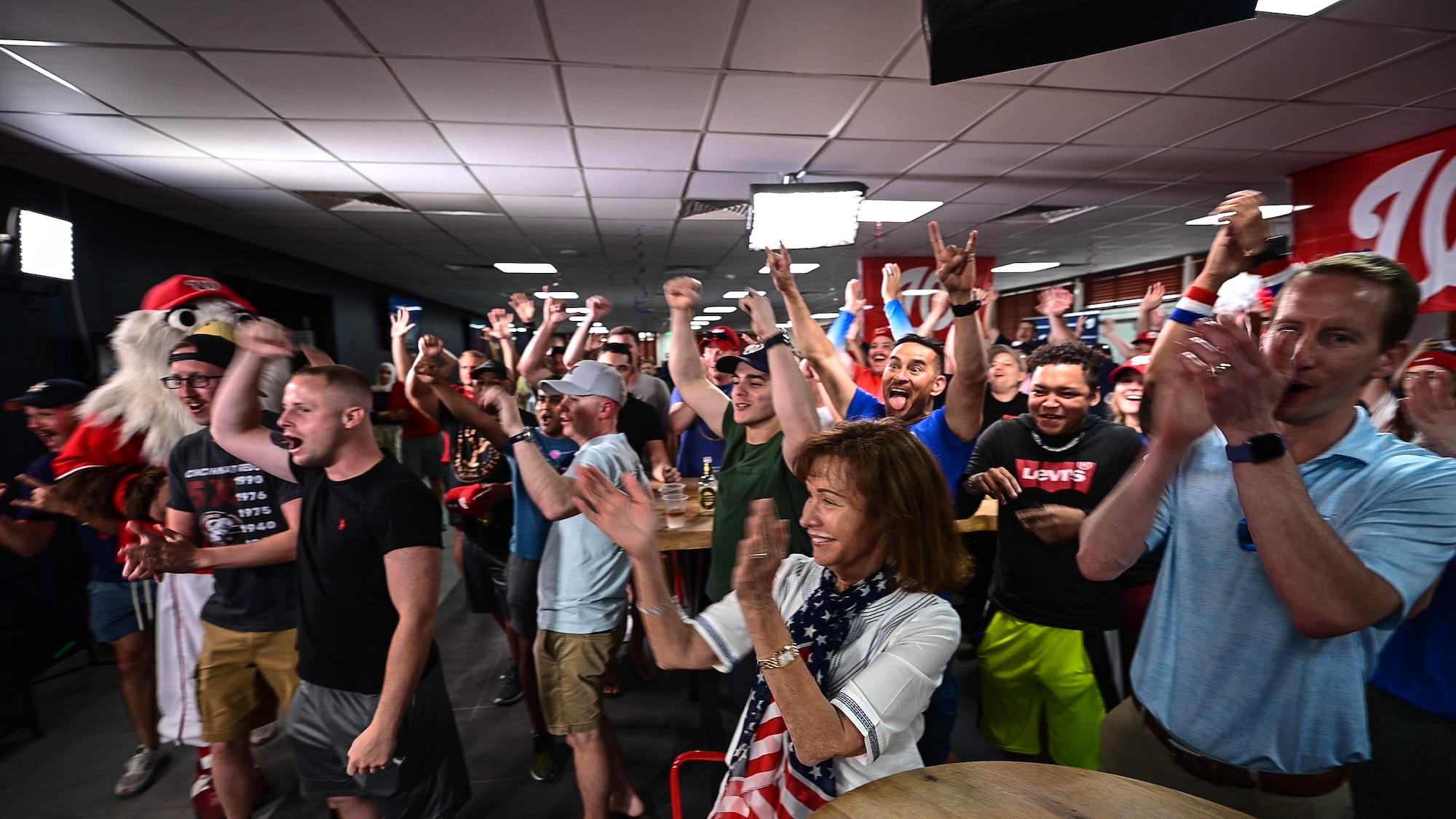 People cheering in a crowd
