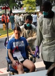 Simulated casualties arrive at Walter Reed during a Code Green mass casualty (MASCAL) exercise on June 29. The exercise tested the medical center's response readiness to receive and provide care during a MASCAL event.