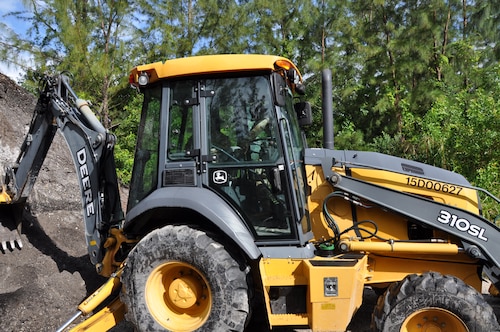 a person trains on a backhoe