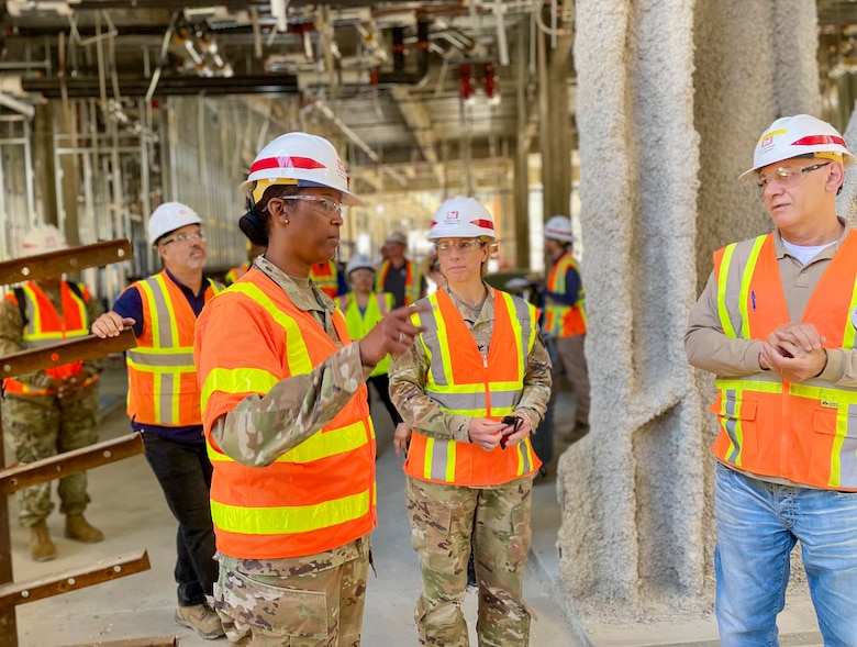 Brig. Gen. Antoinette Gant, U.S. Army Corps of Engineers South Pacific Division commander, foreground left, speaks with Imad Slaiwa, supervisory civil engineer, right, during a June 28 walkthrough of the under-construction Spinal Cord Injury/Community Living Center at the Veterans Affairs San Diego Health Care System campus in San Diego. Accompanying Gant is Col. Julie Balten, Los Angeles District commander, center.