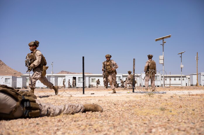 U.S. Marines with 1st Combat Engineer Battalion, 1st Marine Division breach concertina wire with a mock Expedite Bangalore Torpedo during Intrepid Maven 23.4, July 3, 2023. Intrepid Maven is a bilateral exercise between U.S. Marine Corps Forces, Central Command and the Jordanian Armed Forces designed to improve interoperability, strengthen partner-nation relationships in the U.S. Central Command area of responsibility, and improve both individual and bilateral unit readiness.