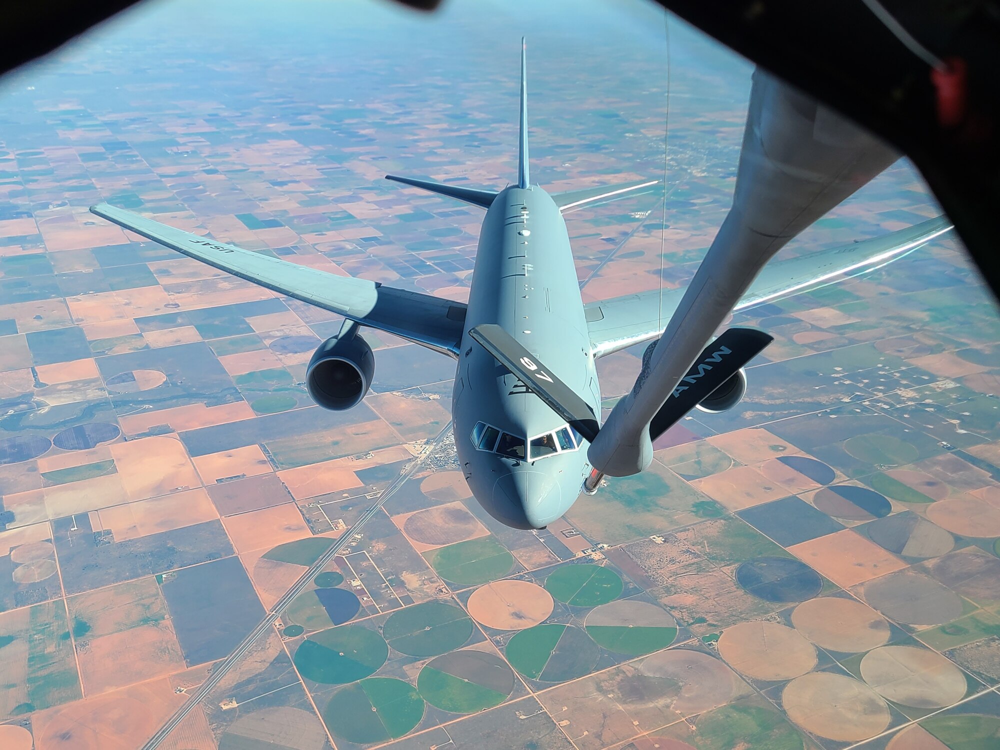 A KC-46 Pegasus is refueled by a KC-135 Stratotanker from Altus Air Force Base, Oklahoma, in Oklahoma airspace, Oct. 20, 2022. The KC-46 is the newest air refueling aircraft, working alongside the KC-135 to fuel the mobility force. (Courtesy photo)