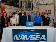 delegation from Naval Surface Warfare Center Panama City Division, Brown University, Office of Naval Research, Duke University and Human Systems Integrations commemorate the signing of a Cooperative Research and Development Agreement (CRADA), May 22. The CRADA aims to develop technology solutions to protect high speed craft operators from injurious environmental conditions, specifically the repeated mechanical shock a body endures when quickly navigating open water. (U.S. Navy photo by Sgt. Alex Morgan)