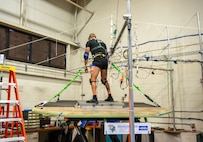 A U.S. Coast Guard Test Participant is free standing on a Moog 6DOF motion simulator while being exposed to simulated Sea State III conditions, May 23. The test was divided into two Phases, with and without a representative high speed craft standing bolster. Many high speed craft still rely on operators to stand and use their legs as shock absorbers. (U.S. Navy photo by Ronnie Newsome)