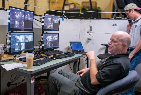(front) Dr. Dale Bass, Duke University, and Blake Draut, Naval Surface Warfare Center Panama City Division Human Systems Integration (HSI) monitor video and force plate data collection, May 23. HSI is a required systems engineering process in defense acquisition to provide a disciplined, unified, and interactive approach to integrate human considerations across system design to optimize total system performance and minimize life-cycle costs. (U.S. Navy photo by Ronnie Newsome)