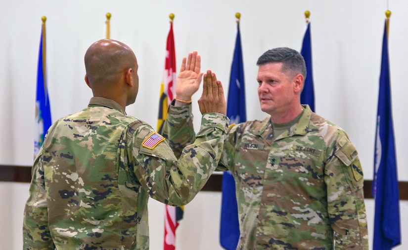 Captain Venkatesh Srinivasan, left, repeats the Oath of Office after Maj. Gen. Martin Klein, commanding general, U.S. Army Reserve Innovation Command, during Srinivasan’s commissioning ceremony at Joint Reserve Base Ellington, Texas on June 25, 2023. Srinivasan joined the Army Reserve in October 2015 and worked tirelessly to receive a direct commission as an officer at the rank of captain. (U.S. Army photo by Maj. Charles An, U.S. Army Reserve Innovation Command)