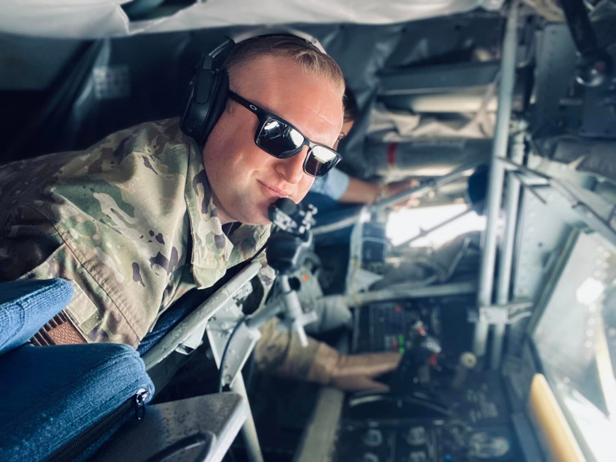 U.S. Air Force Master Sgt. Brendan Balko, 97th Operations Group KC-135 Stratotanker chief evaluator boom operator, lays in the boom pod in airspace above Oklahoma, Oct. 13, 2022. Balko has been flying in the KC-135 for nearly 16 years. (Courtesy photo)