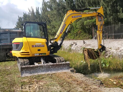 a person operates an excavator