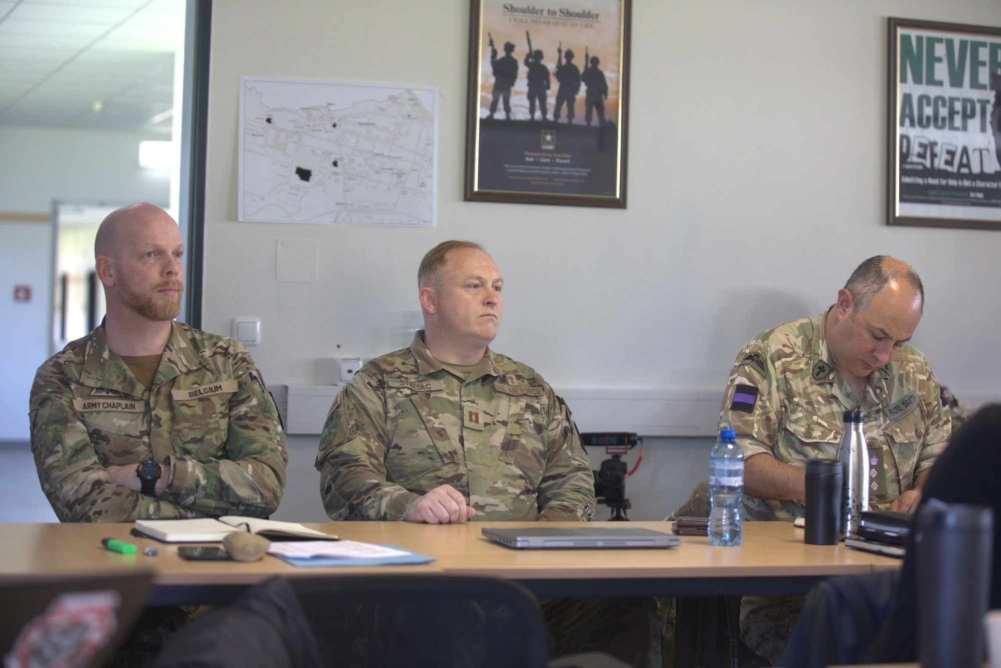 Maj. Hans Van Wichelen, Chaplain of the Belgium Army's Directorate General Health and Wellbeing, left, Maryland Air National Guard Chaplain (Capt.) Vladimir Steliac, assigned to 175th Wing, Air National Guard Readiness Center at Joint Base Andrews, Maryland, middle, and British Army Reverend (Col.) Richard Smith, assistant chaplain general, 3rd Division Headquarters, right, observes religious support training focused on planning, preparing, executing, and assessing religious support programs in Grafenwoehr, Germany, March 4, 2023.