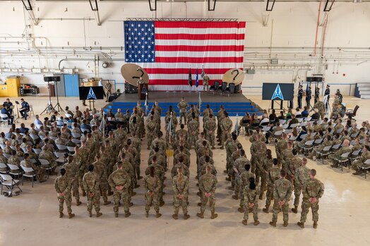  Airmen and Guardians from Delta 3-Space Electromagnetic Warfare stand in formation ahead of the DEL 3 change of command ceremony June 29, 2023, at Peterson Space Force Base. DEL 3 trains and presents operational combat-ready space electromagnetic warfare forces in support of assigned missions. (U.S. Space Force photo by Airman 1st Class Cody Friend)