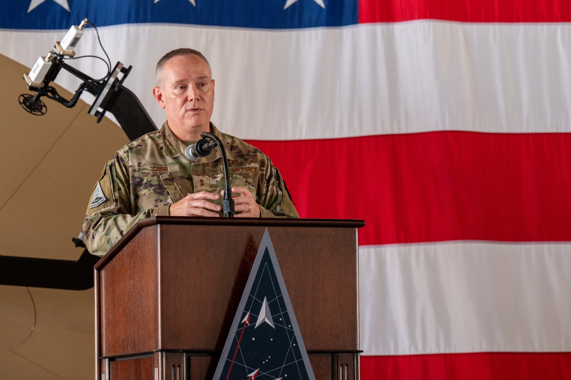 U.S. Air Force Maj. Gen. Patrick Cobb, Air National Guard Assistant to the Commander, Space Operations Command speaks during the Delta 3-Space Electromagnetic Warfare change of command ceremony June 29, 2023, at Peterson Space Force Base. Cobb recognized the efforts of DEL 3 members, the outgoing commander, and the incoming commander during his speech. (U.S. Space Force photo by Airman 1st Class Cody Friend)