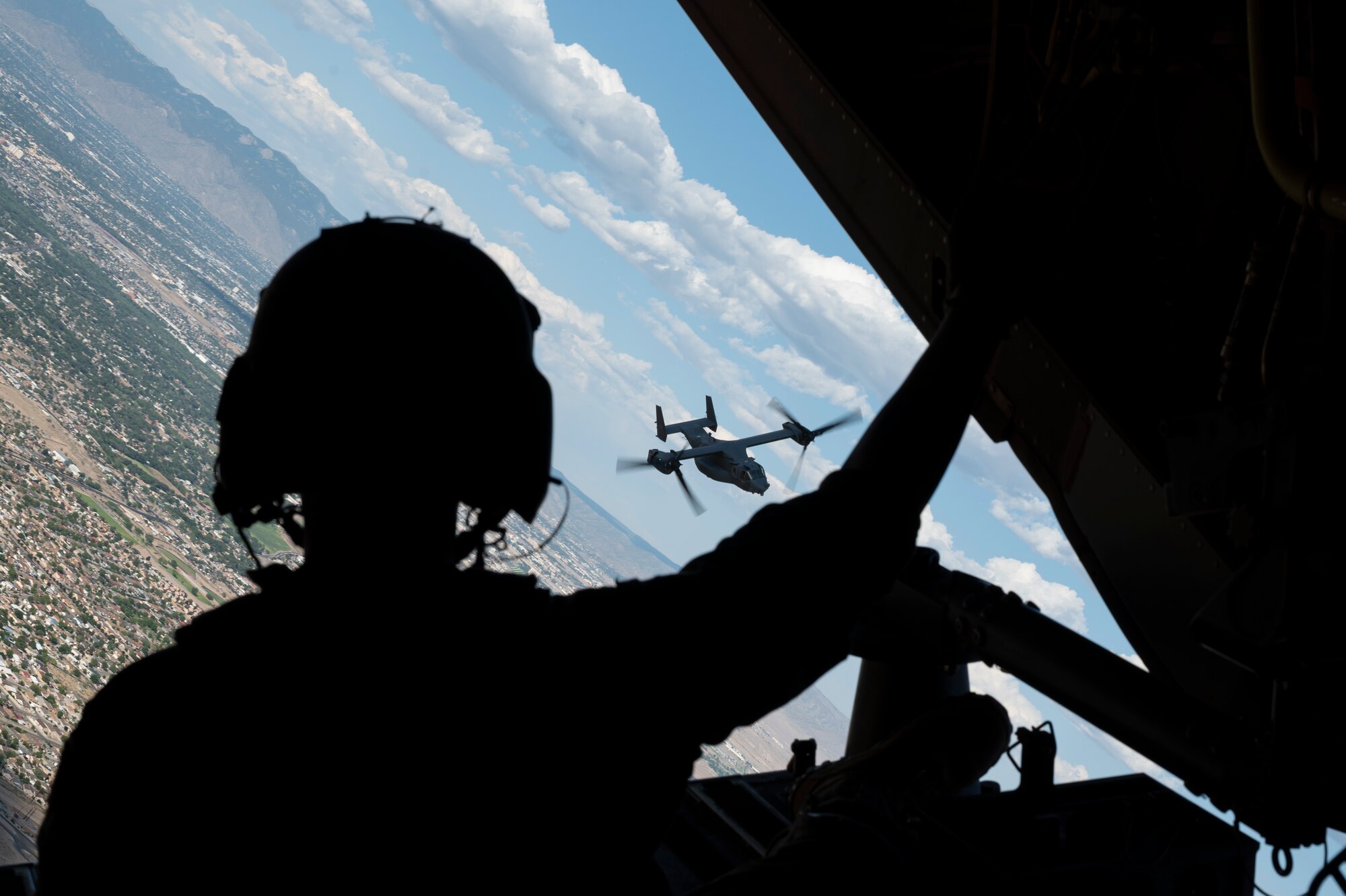 A Cv-22 flies over ABQ.