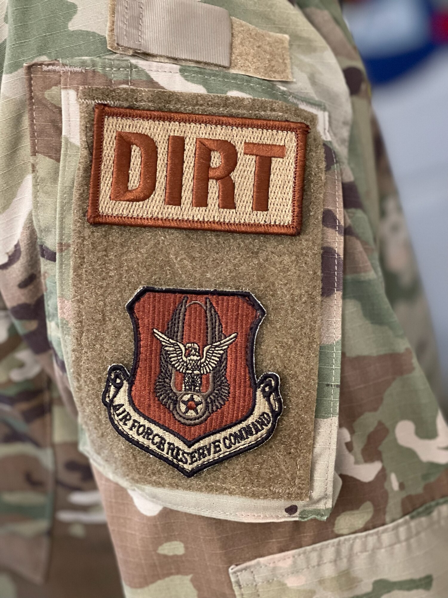 a man poses for a photo of his patch