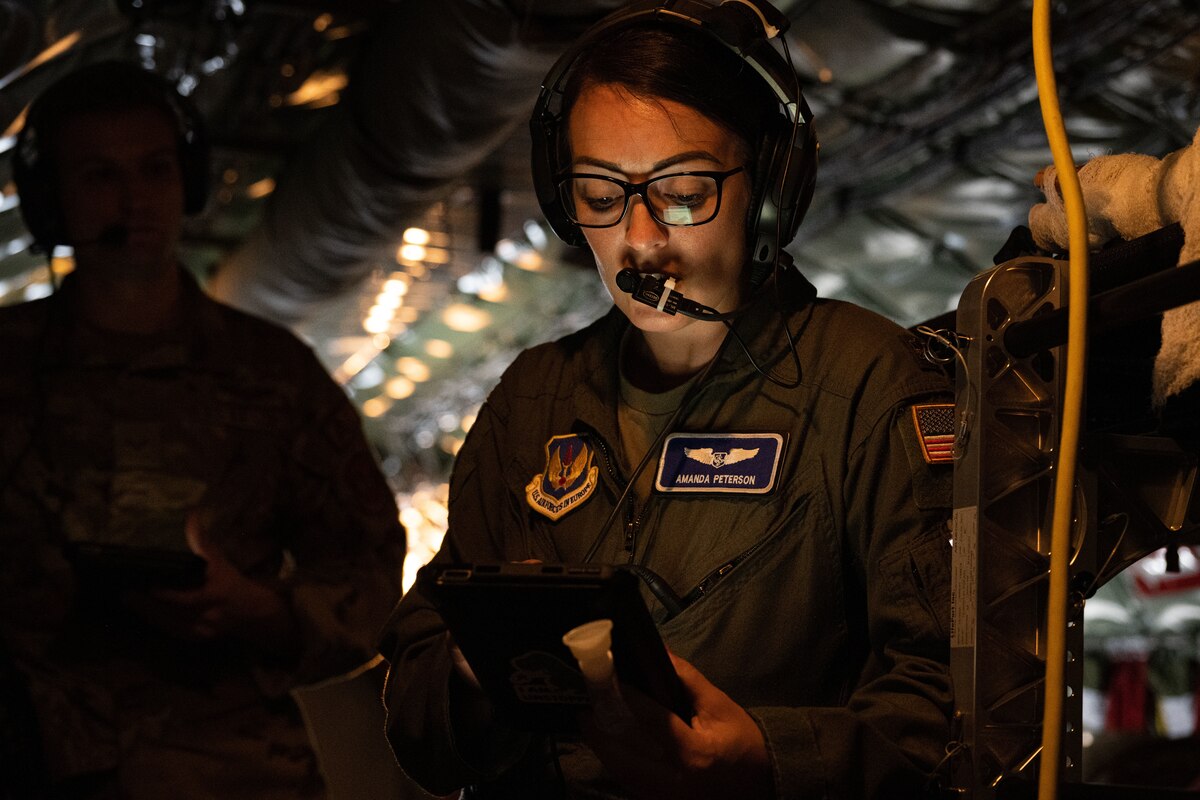 A service member trains other service members.
