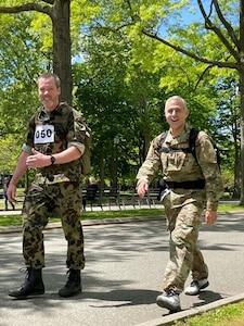 Photo of two people walking.