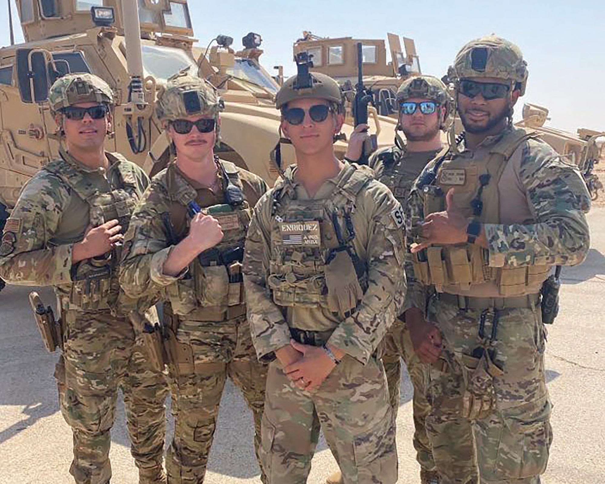 Staff Sgt. Brandon Walker, second from left, 445th Security Forces Squadron, poses for a photo with fellow defenders at Prince Sultan AB Saudi Arabia last year. SFS Airmen are responsible for defending air bases around the globe, law enforcement on those bases, missile security, combat arms and handling military working dogs.