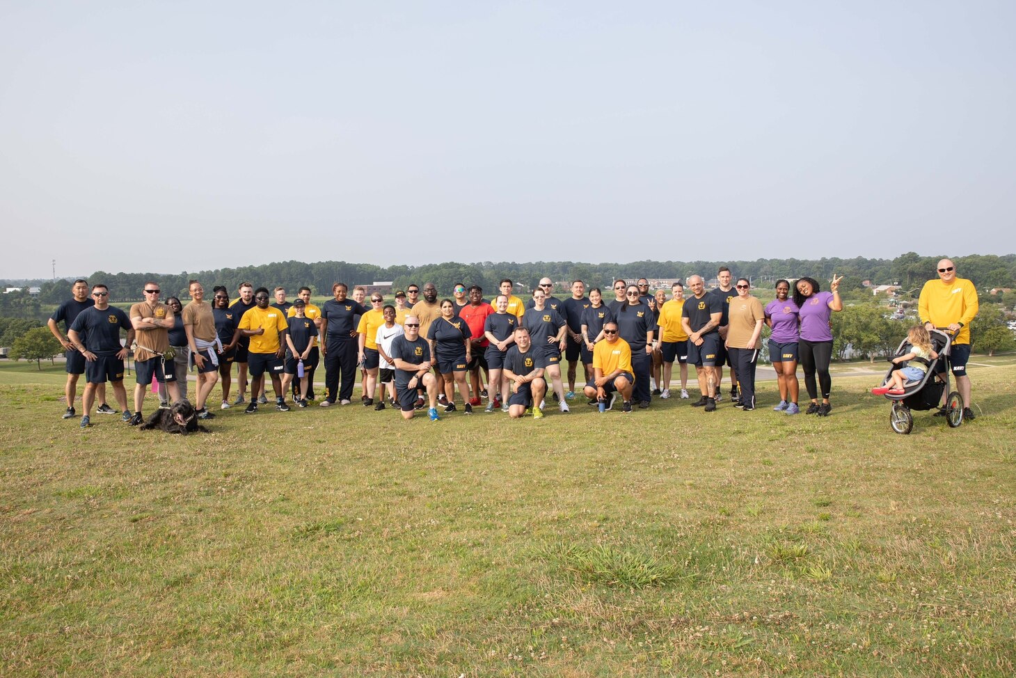 Sailors in physical training uniform pose for a group photo