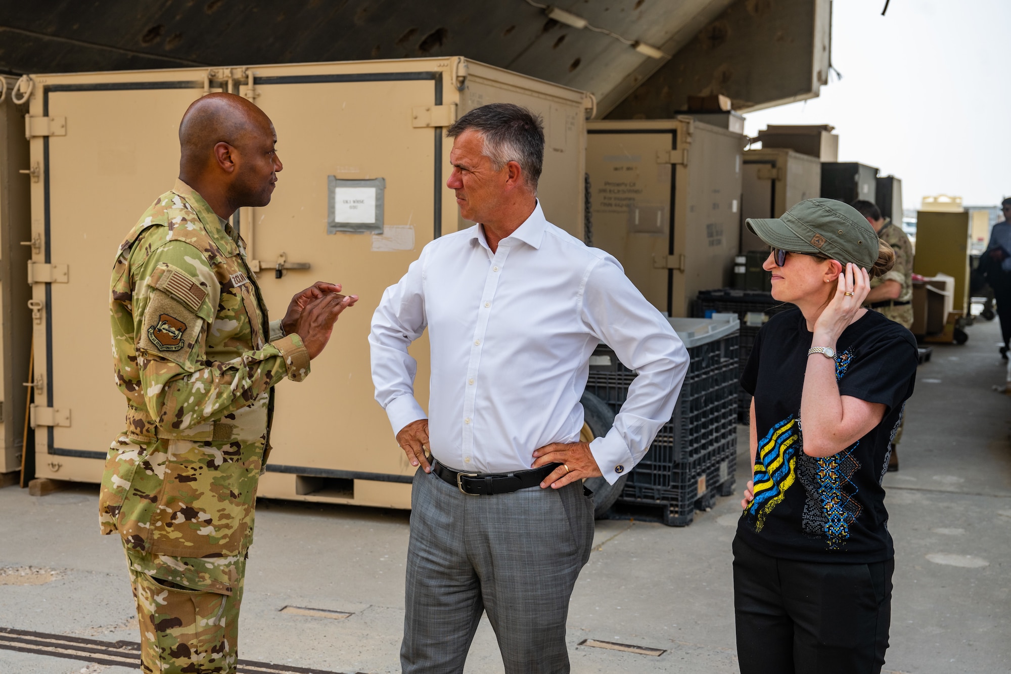 From left, U.S. Air Force Col. Damion Holtzclaw, 386th Air Expeditionary Wing deputy commander, Lord Mark Lancaster, United Kingdom Government’s Defence Export Advocate, and Ambassador Belinda Lewis, British Ambassador to Kuwait, share a conversation during a tour at Ali Al Salem Air Base, Kuwait, July 4, 2023. A group of U.K. leaders traveled to Kuwait to foster the working relationship between the U.K. and their Kuwaiti partners, and the visit also provided the opportunity for the U.S. to further the connection with our coalition partners on a strategic level. (U.S. Air Force photo by Staff Sgt. Kevin Long)
