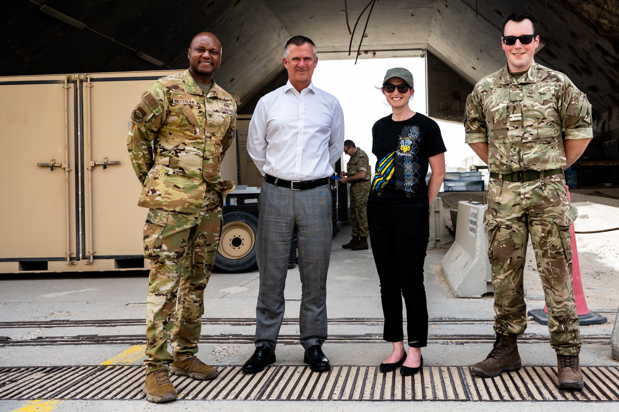From left, U.S. Air Force Col. Damion Holtzclaw, 386th Air Expeditionary Wing deputy commander, Lord Mark Lancaster, United Kingdom Government’s Defence Export Advocate, and Ambassador Belinda Lewis, British Ambassador to Kuwait, and Royal Air Force Flight Lieutenant Nicholas Lloyd pose for a photo at Ali Al Salem Air Base, Kuwait, July 4, 2023. A group of U.K. leaders traveled to Kuwait to foster the working relationship between the U.K. and their Kuwaiti partners, and the visit also provided the opportunity for the U.S. to further the connection with our coalition partners on a strategic level. (U.S. Air Force photo by Staff Sgt. Kevin Long)