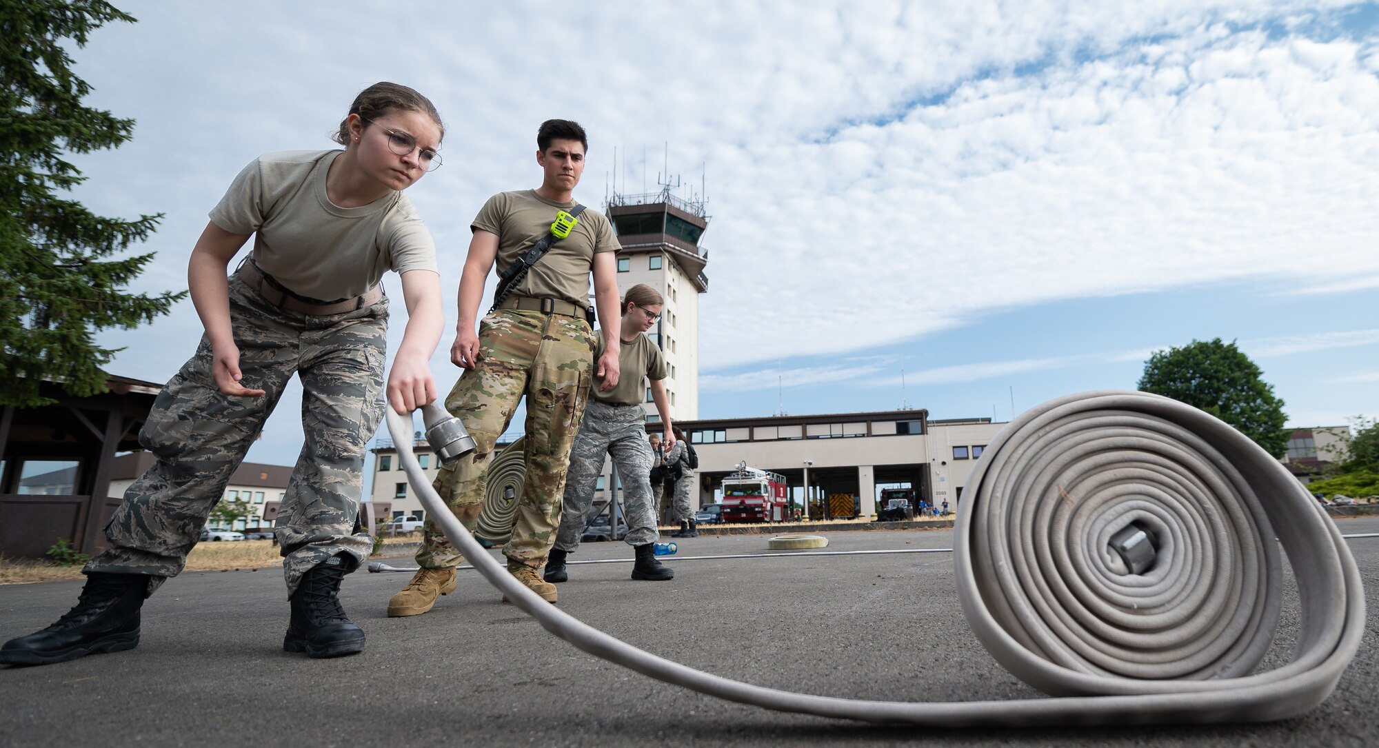 people roll out hoses