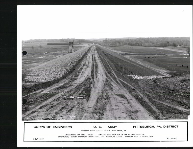 A historic photo of the Woodcock Creek dam crest taken during its construction in 1973.