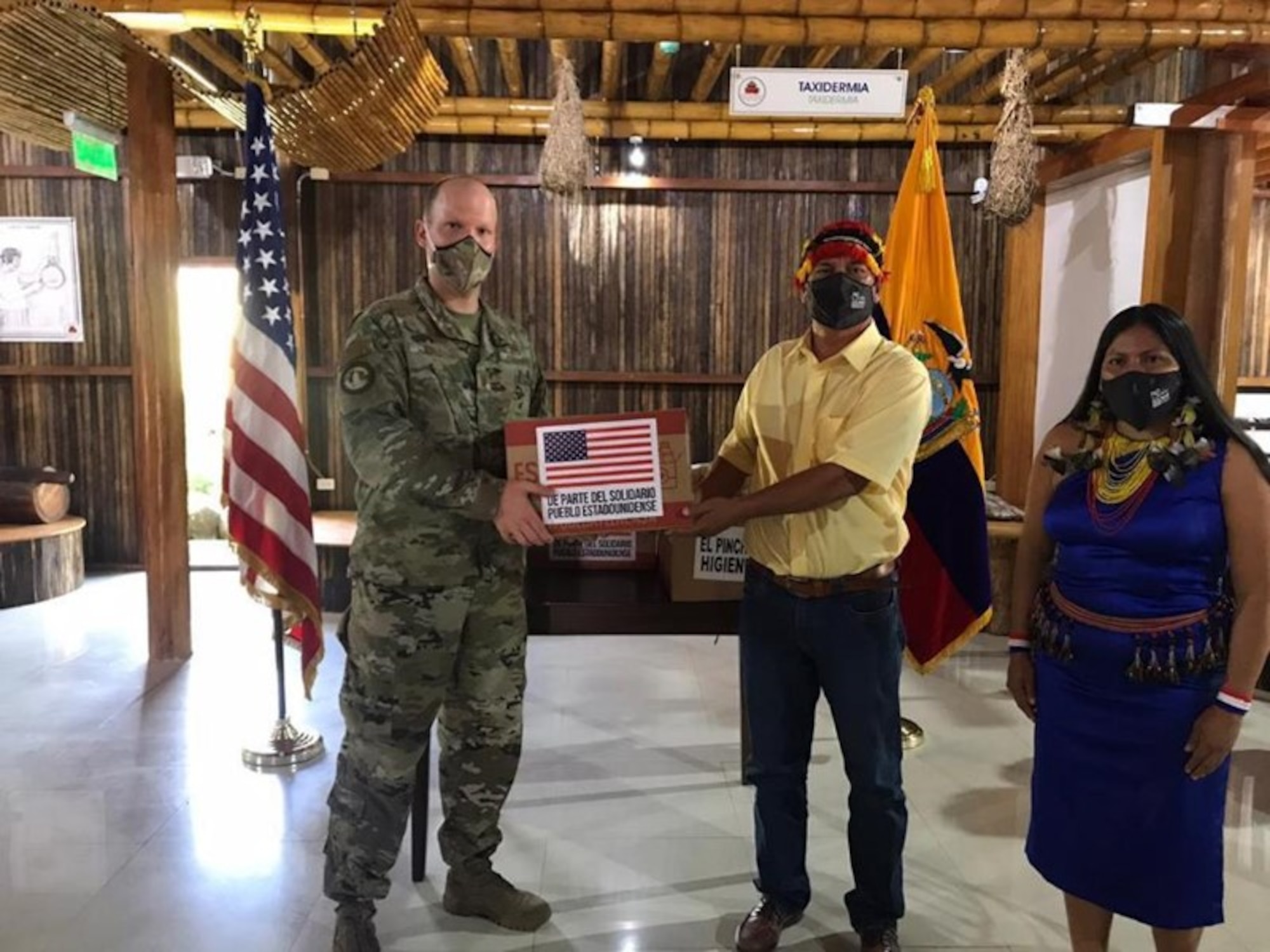 Then Maj Michael Ball, SCO Chief Ecuador, handing a food and hygiene kit donation to indigenous groups in the southern Ecuador province of Zamora during the COVID-19 pandemic.