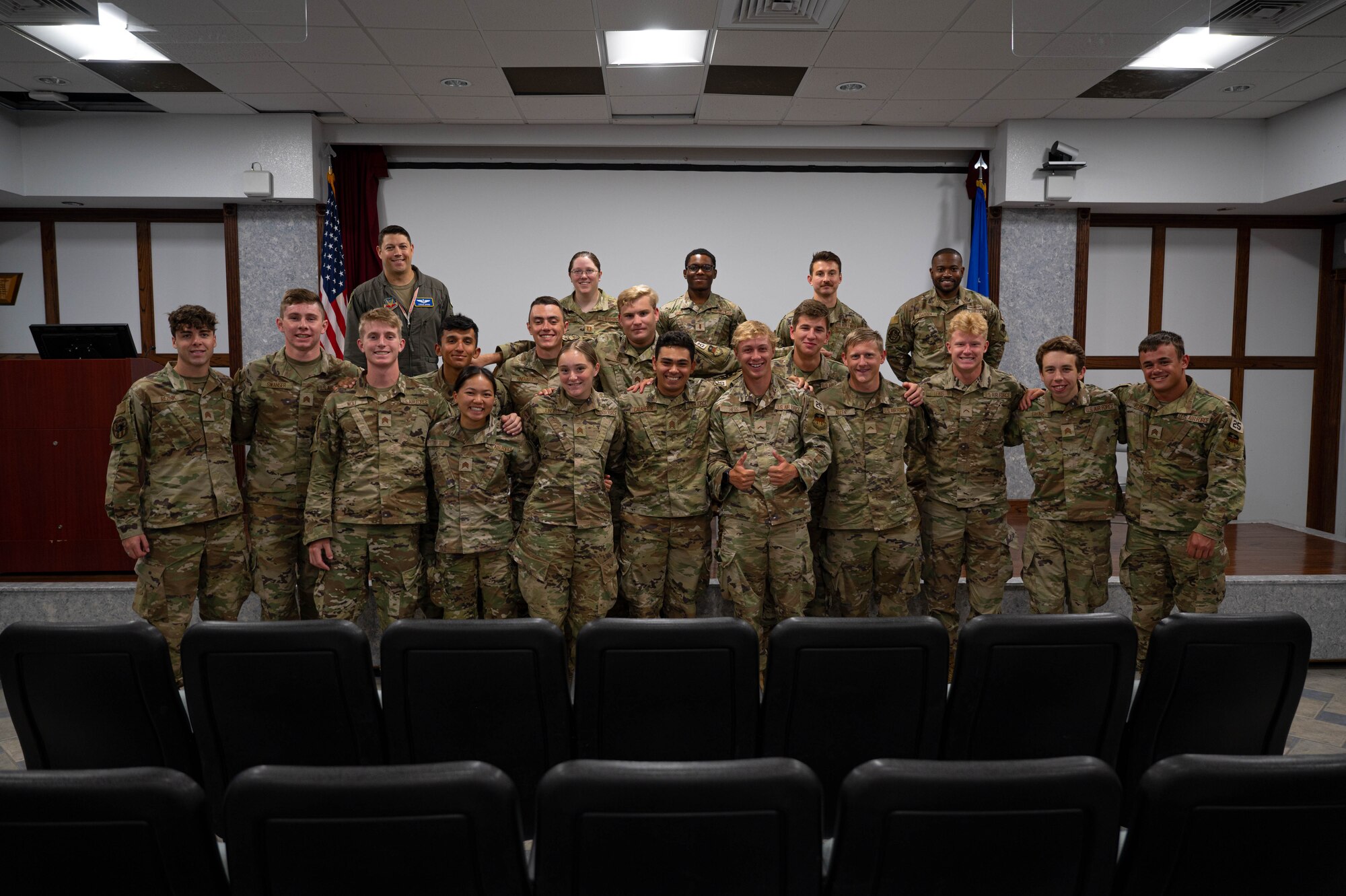 Officers from the 350th Spectrum Warfare Wing and cadets from the U.S. Air Force Academy pose for a group photo after an officer panel during a visit at Eglin Air Force Base, Fla., June 20, 2023. Cadets visited Eglin AFB as part of a professional development summer session to learn more about officer life and the operational Air Force. (U.S. Air Force photo by 1st Lt. Benjamin Aronson)