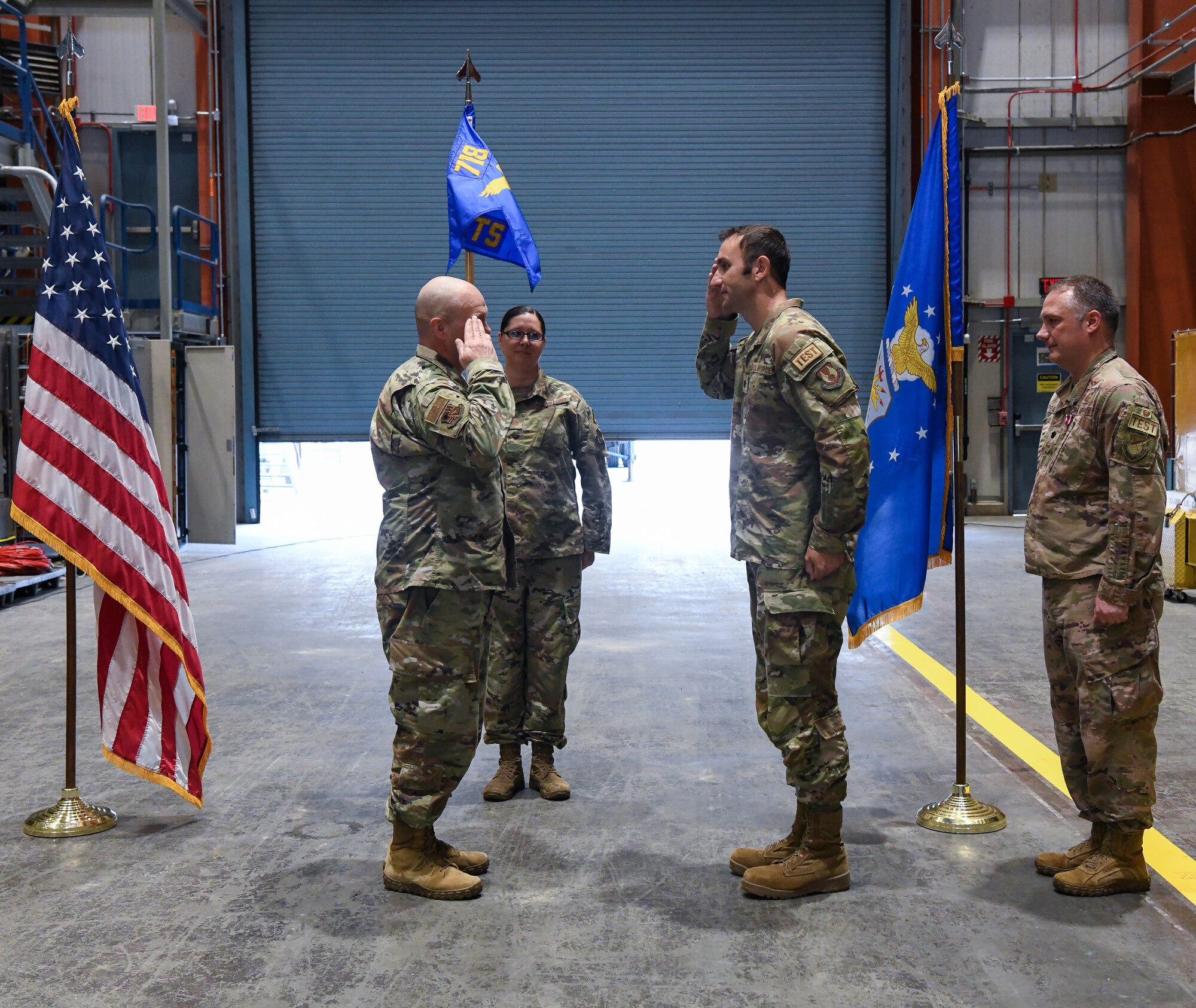 Lt. Col. Bradley Breaux, center, salutes Col. Jason Vap, commander of the 804th Test Group, Arnold Engineering Development Complex, after accepting command of the 718th Test Squadron during a change of leadership ceremony at Arnold Air Force Base, Tenn., June 15, 2023. Also pictured at right is Lt. Col. Dayvid Prahl, who relinquished leadership of the squadron during the ceremony. (U.S. Air Force photo by Jill Pickett)