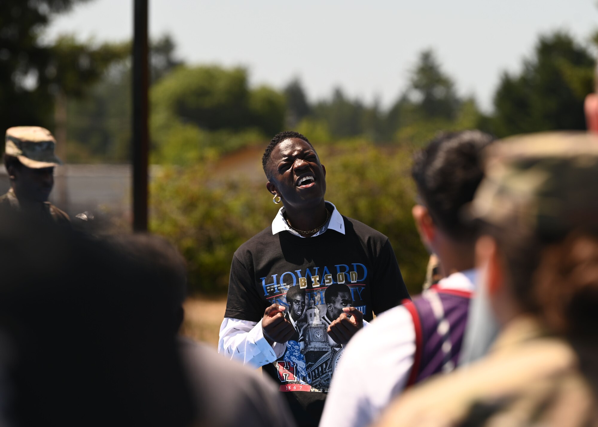 U.S. Air Force Airman 1st Class Spencer Watts, parking and crating apprentice with the 627th Logistics Readiness Squadron, performs Lift Every Voice and Sing at a Juneteenth Block Party at Joint Base Lewis-McChord, Washington, June 15, 2023. Airmen and their families who spent time at the Juneteenth Block Party were able to enjoy food, bouncy houses, games and one another’s company, while they celebrated the emancipation of enslaved African Americans. (U.S. Air Force photo by Senior Airman Callie Norton)