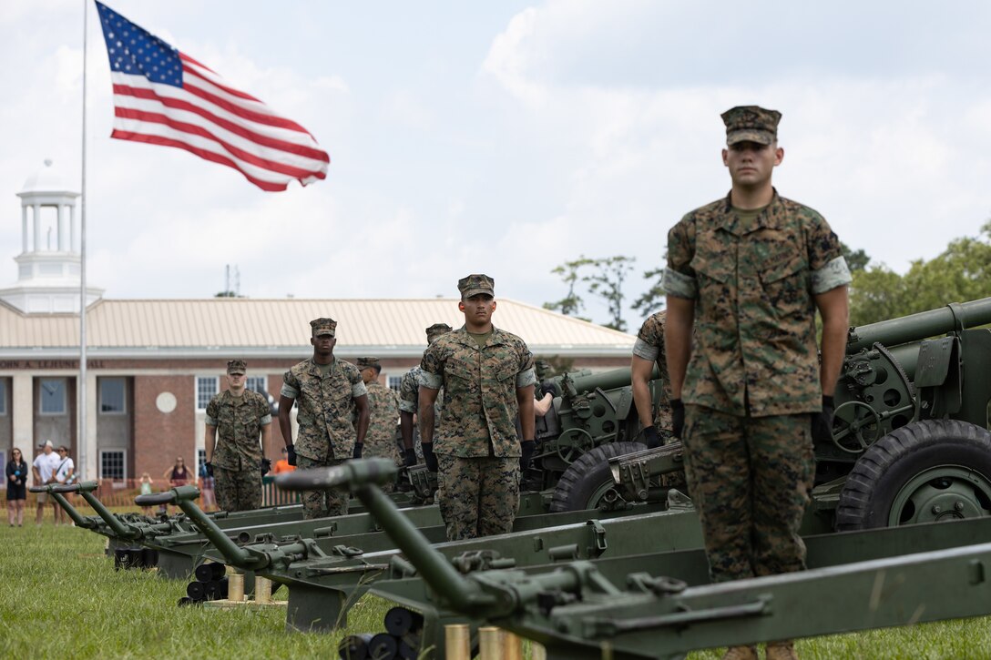U.S. Marines with Headquarters Battery, 10th Marine Regiment, 2d Marine Division, prepare to fire during the Independence Day 21-Gun Salute on Marine Corps Base Camp Lejeune, North Carolina, July 4, 2023. The 21-Gun Salute, held in honor of Independence Day, is a brief ceremony during which guns are discharged 21 times at 5 second intervals. (U.S. Marine Corps photo by Cpl. Antonino Mazzamuto)