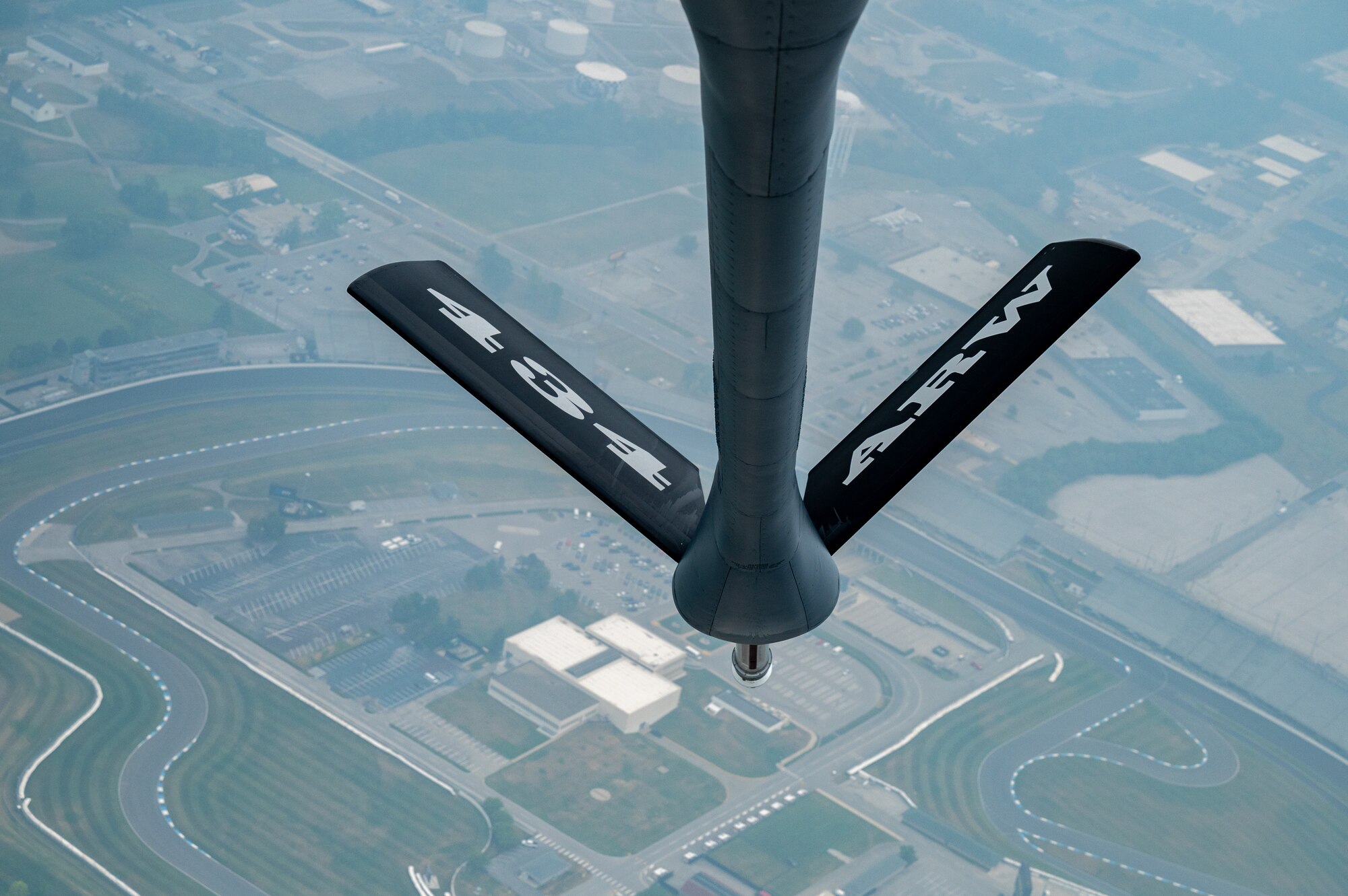 A KC-135R Stratotanker assigned to the 434th Air Refueling Wing flies over the Indianapolis Motor Speedway, Ind., as part of Operation Centennial Contact, June 27, 2023. Airmen assigned to Grissom Air Reserve Base flew over the landmark as part of a nationwide aerial refueling demonstration that commemorated the 100th anniversary of in-flight refueling. (U.S. Air Force photo by Senior Airman Alexis M. Morris)