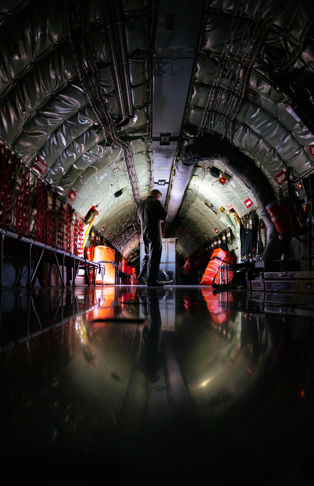 U.S. Air National Guardsman Maj. Jordon Birt, 161st Air Refueling Wing instructor pilot, inspects a KC-135 Stratotanker.