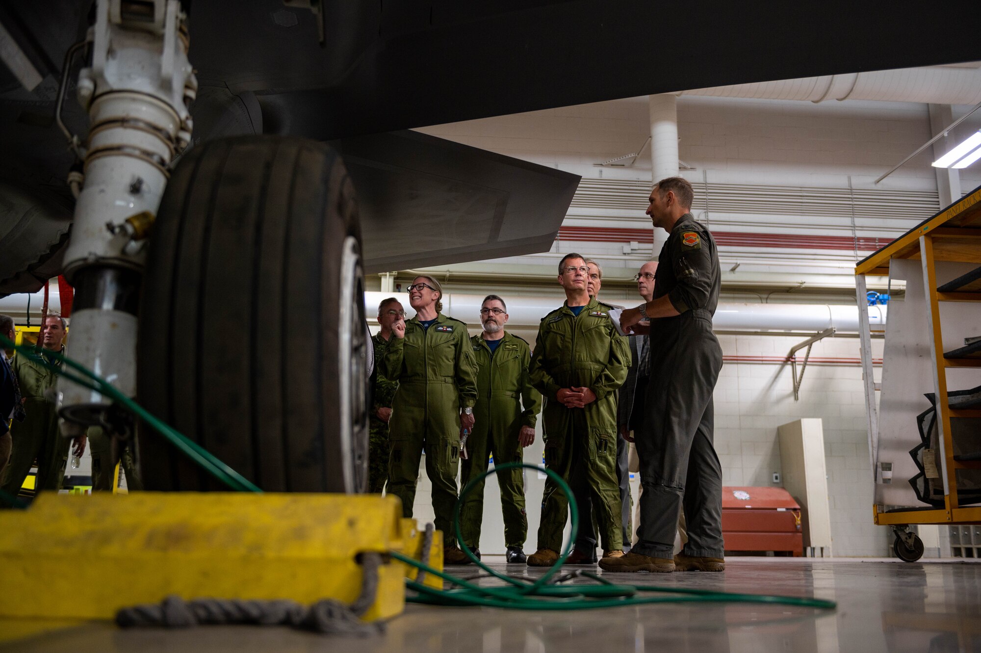 Royal Canadian Air Force leadership, including Lt. Gen. Eric Kenny, RCAF commander, receives an F-35A Lightning II briefing from U.S. Air Force Col. Matthew Johnston, 56th Operations Group commander.