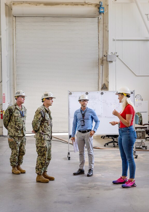 Capt. JD Crinklaw, middle left, commander, Puget Sound Naval Shipyard & Intermediate Maintenance Facility, tours the San Diego Detachment June 27, 2023, with (from left) Cmdr. Brandon Johnson, executive officer, PSNS & IMF; Jeremy Miller, director, San Diego Detachment; and Tanya Lalicker, Detachment site manager. (U.S. Navy photo by Wendy Hallmark)