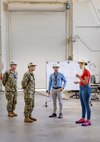 Capt. JD Crinklaw, middle left, commander, Puget Sound Naval Shipyard & Intermediate Maintenance Facility, tours the San Diego Detachment June 27, 2023, with (from left) Cmdr. Brandon Johnson, executive officer, PSNS & IMF; Jeremy Miller, director, San Diego Detachment; and Tanya Lalicker, Detachment site manager. (U.S. Navy photo by Wendy Hallmark)