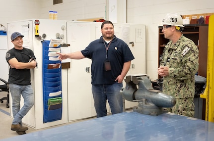 Capt. JD Crinklaw, commander, Puget Sound Naval Shipyard & Intermediate Maintenance Facility, visits with Andrew Lerch, supervisor, Shop 38, Marine Machinery, and Mavrick Mooneyham, Shop 38 work lead June 27, 2023, during an awards ceremony at the San Diego Detachment. It was his first visit there since becoming commander at PSNS & IMF. Crinklaw also toured the Portsmouth Naval Shipyard Point Loma Detachment and observed a Point Loma Radiological Emergency Response drill during his trip. (U.S. Navy photo by Wendy Hallmark)