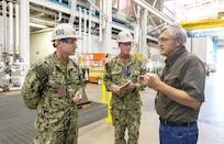 Capt. JD Crinklaw, left, commander, Puget Sound Naval Shipyard & Intermediate Maintenance Facility, and Cmdr. Brandon Johnson, PSNS & IMF executive officer, visit with Bill Schoonmaker, supervisor, Shop 31, Inside Machinist, June 27, 2023, during their tour of the San Diego Detachment. (U.S Navy Photo by Wendy Hallmark)