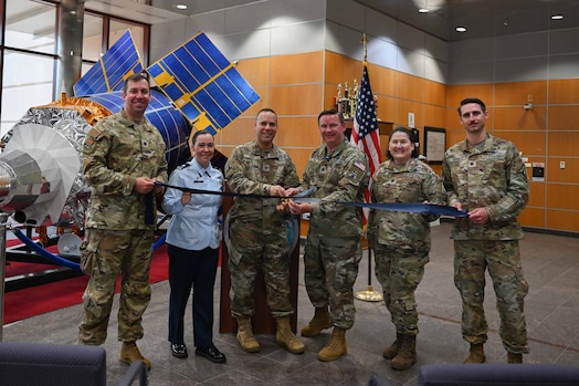  Members pose with a ribbon