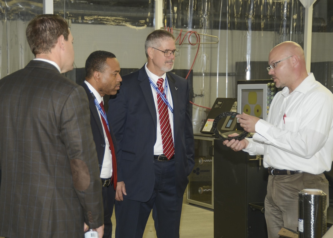 The late Dr. David E. Walker, center, a beloved former Air Force Research Laboratory, or AFRL, director and vice commander, is pictured during a visit to the Air Force Research Laboratory’s Rocket Propulsion Division at Edwards Air Force Base, Calif., Sept. 23, 2015. At the time of this visit, Walker served as deputy assistant secretary of the Air Force for science, technology and  engineering in the Office of the Assistant Secretary of the Air Force for Acquisition. According to his former colleagues, in this role Walker advocated passionately for AFRL and worked tirelessly to maintain and protect its defense budget. (U.S. Air Force photo / Kenji Thuloweit)