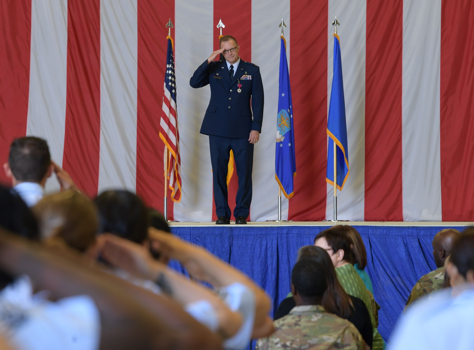 U.S. Air Force Col. Richard McClure, 86th Medical Group outgoing commander, renders his final salute to Airmen assigned to the 86th MDG during a change of command ceremony at Ramstein Air Base, Germany, July 6, 2023. The 86th MDG is composed of five squadrons with 966 personnel assigned at two geographically separate locations. (U.S. Air Force photo by Airman Trevor Calvert)