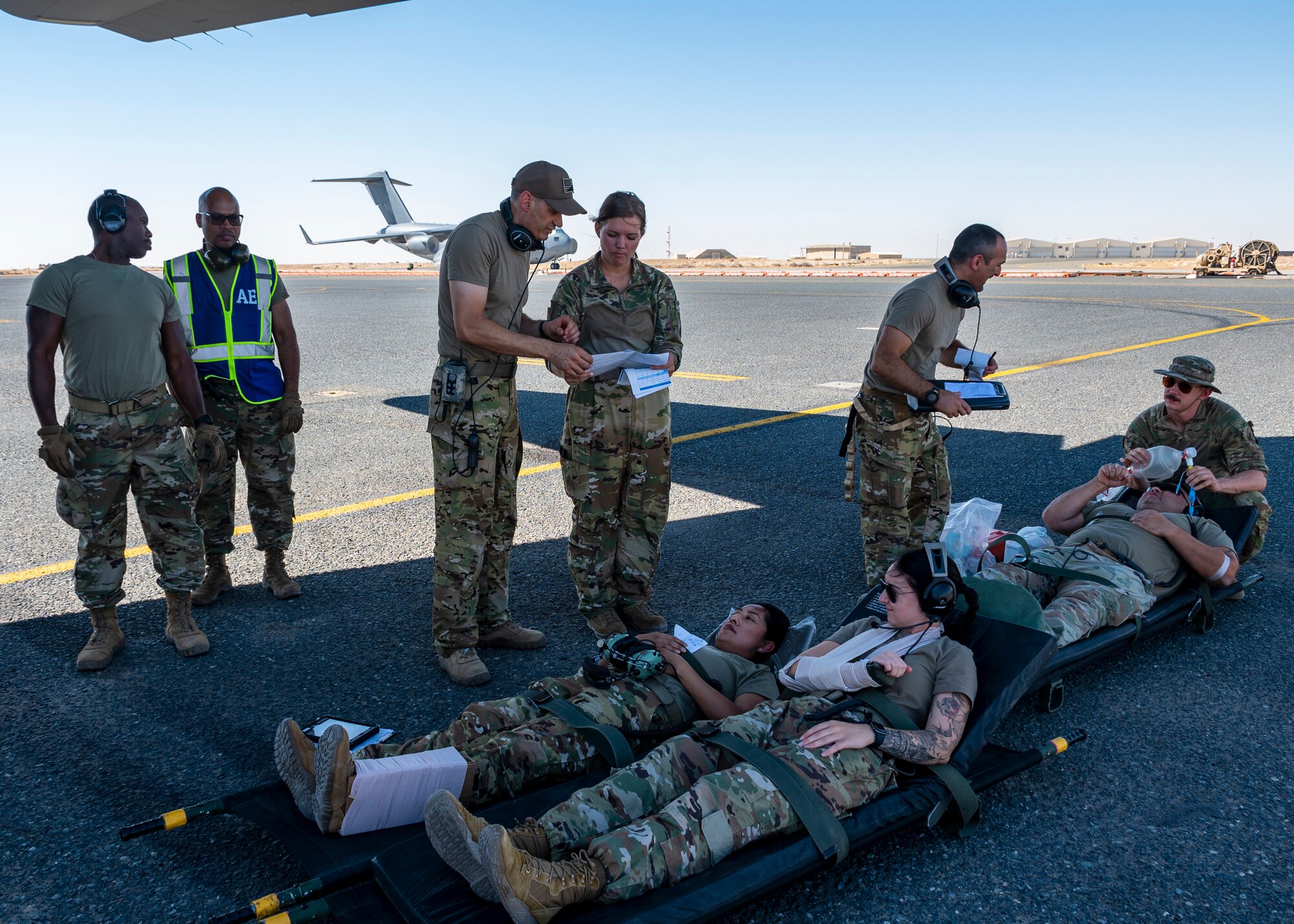 Members from the 405 Expeditionary Aeromedical Evacuation Squadron (EAES), and the 379 EAES Critical Care Air Transport Team (CCATT), from Al Udeid Air Base, Qatar, participate in a combined training that provides the CCATT a unique opportunity to train and integrate with the EAES at Ali Al Salem Air Base, Kuwait, June 29, 2023.