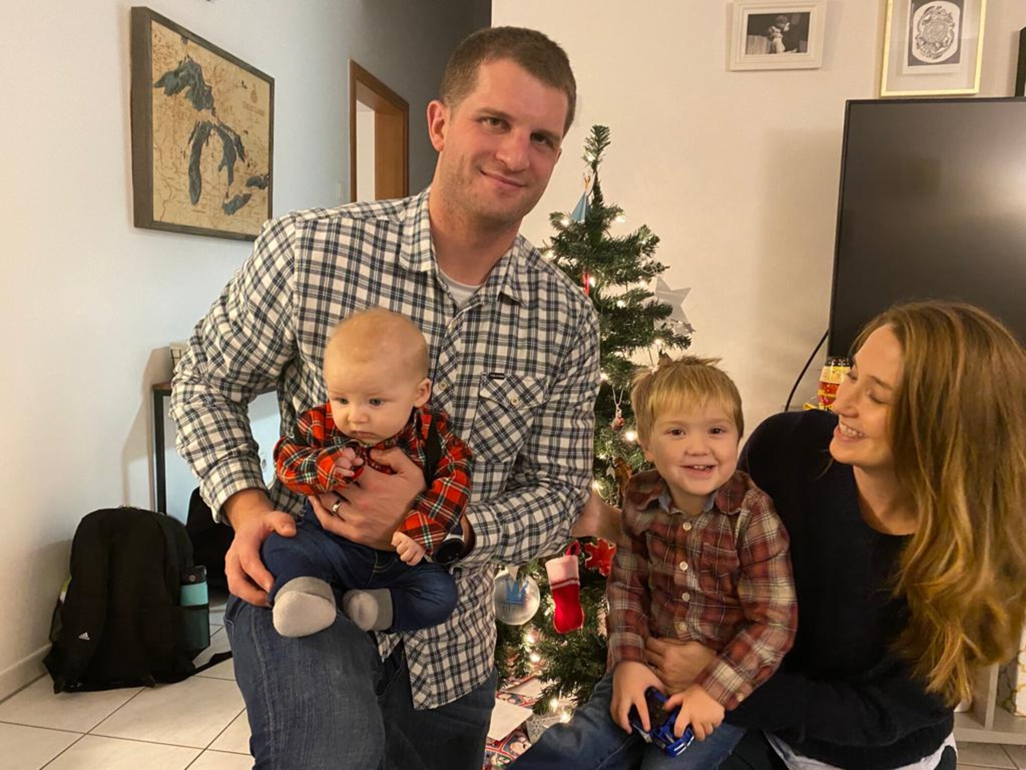 U.S. Air Force Tech Sgt. Paul Vermaire, 86th Operations Support Squadron air traffic controller, gathers with his family at Ramstein Air Base, Germany, Dec. 25, 2022.