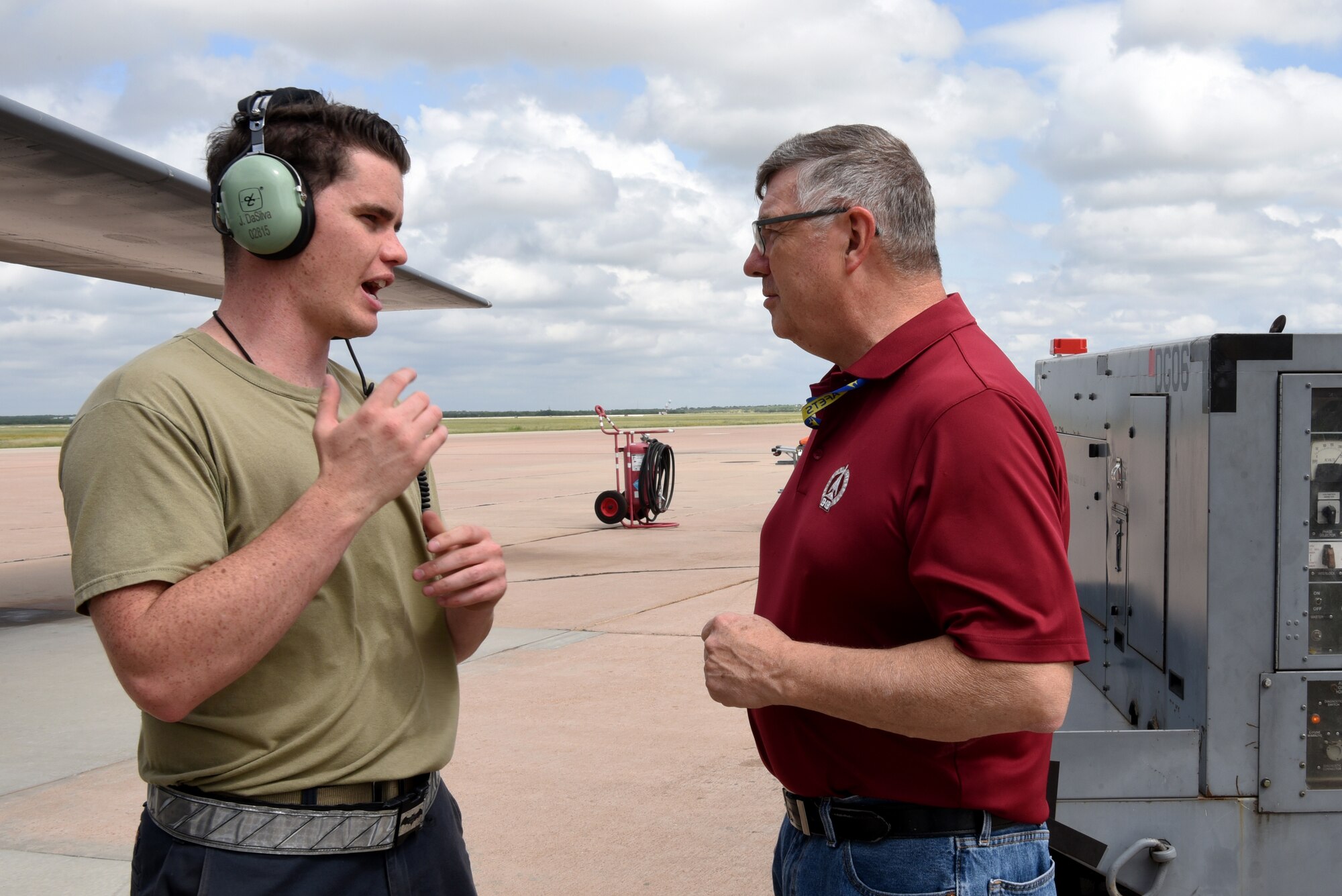 Philip Hermes, 7th Maintenance Group Air Force Engineering Technical Services program weapons system specialist, talks to Senior Airman Joseph DaSilva, 7th Aircraft Maintenance Squadron avionics specialist, about fixing issues on a B-1B Lancer on Dyess Air Force Base, Texas, June 2, 2023. Hermes has served with the B-1 at Dyess since his arrival here in 1985. (U.S. Air Force photo by Senior Airman Sophia Robello)